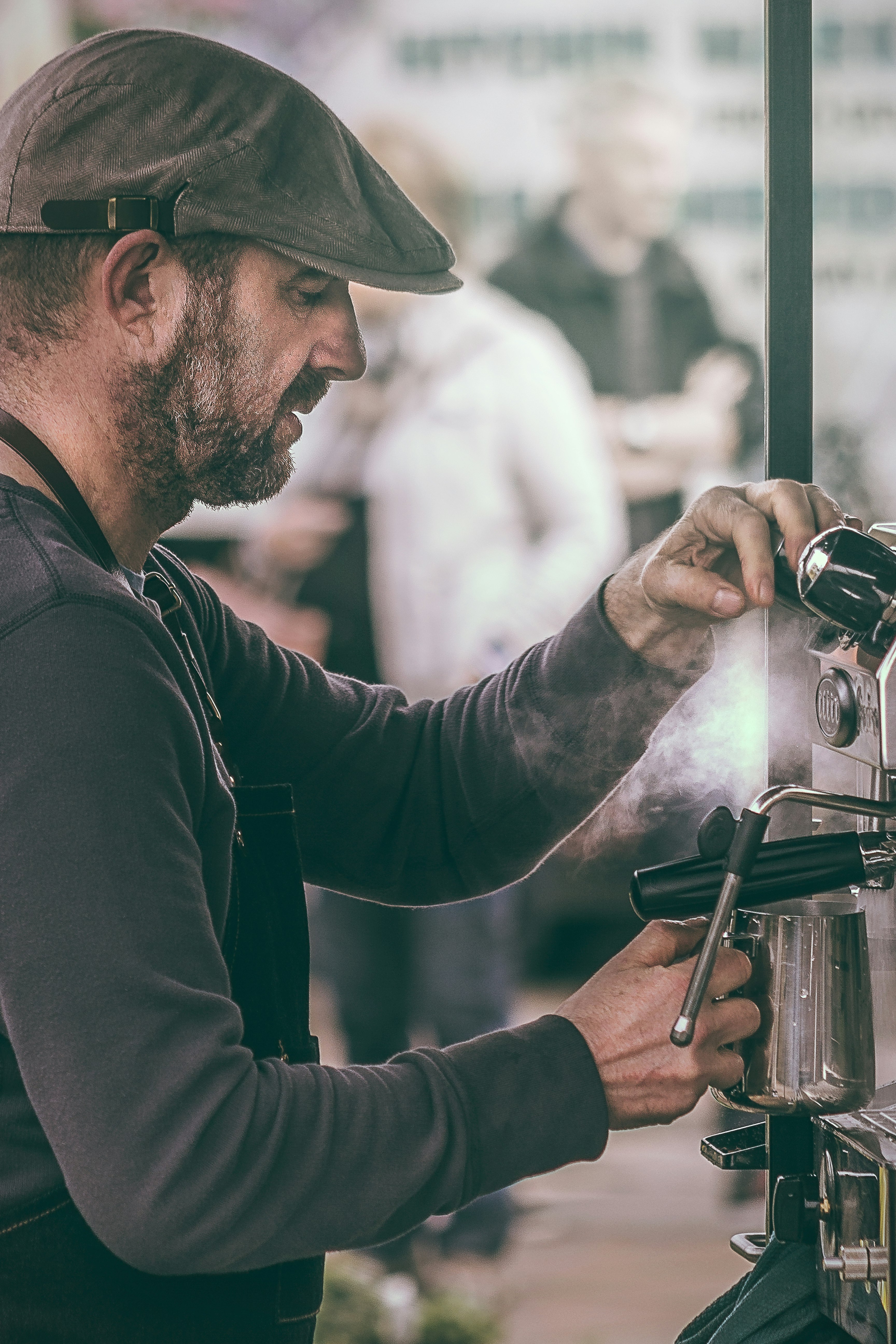 man operating espresso machine